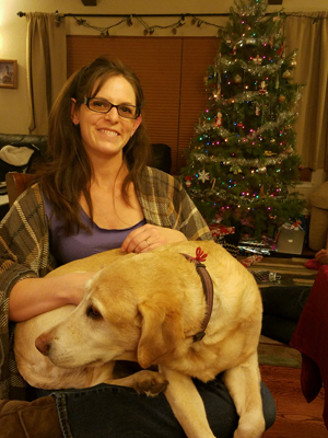 Sasha with her red prayer thread on her collar. From terminal to healed. No more lesions. Fur has grown back. Cancer Free!